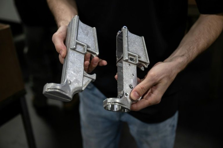Matrix Arms owner and gun manufacturer Allen Farris checks equipment on a production line at his factory in Claremont, New Hampshire on June 3, 2022