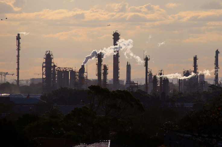 Birds and a plane are seen flying above emission from the chimneys of a chemical plant located near Port Botany in Sydney, Australia June 2, 2017.