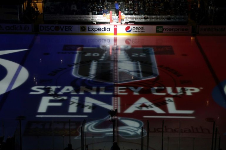 The Stanley Cup Final logo is displayed on center ice before the start of Game One of the NHL championship series between the Tampa Bay Lightning and Colorado Avalanche in Denver