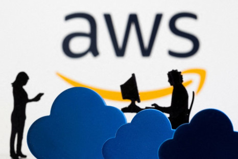 3D printed clouds and figurines are seen in front of the AWS (Amazon Web Service) cloud service logo in this illustration taken February 8, 2022. 