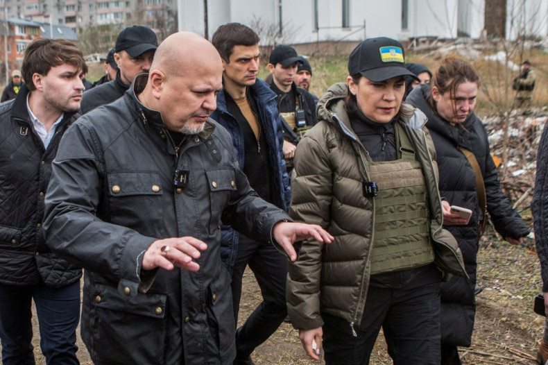 International Criminal Court (ICC) Chief Prosecutor Karim Khan and Ukrainian Prosecutor General Iryna Venediktova visit a site of a mass grave in the town of Bucha, outside Kyiv, Ukraine April 13, 2022. 