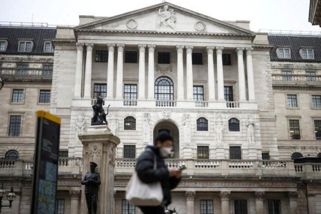 A person walks past the Bank of England in the City of London financial district in London, Britain, January 23, 2022. 