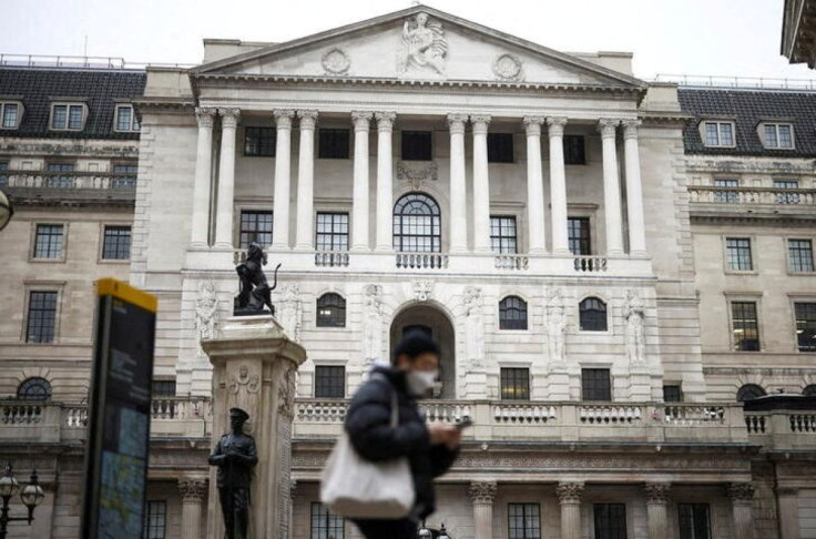 A person walks past the Bank of England in the City of London financial district in London, Britain, January 23, 2022. 