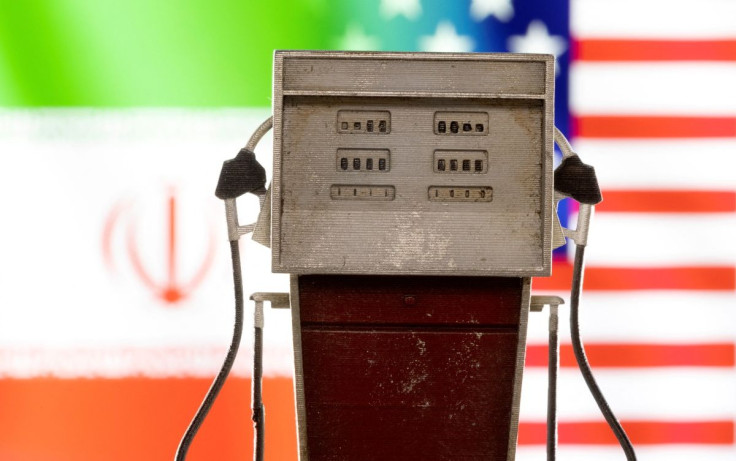 Model of petrol pump is seen in front of U.S. and Iran flag colors in this illustration taken March 25, 2022. 