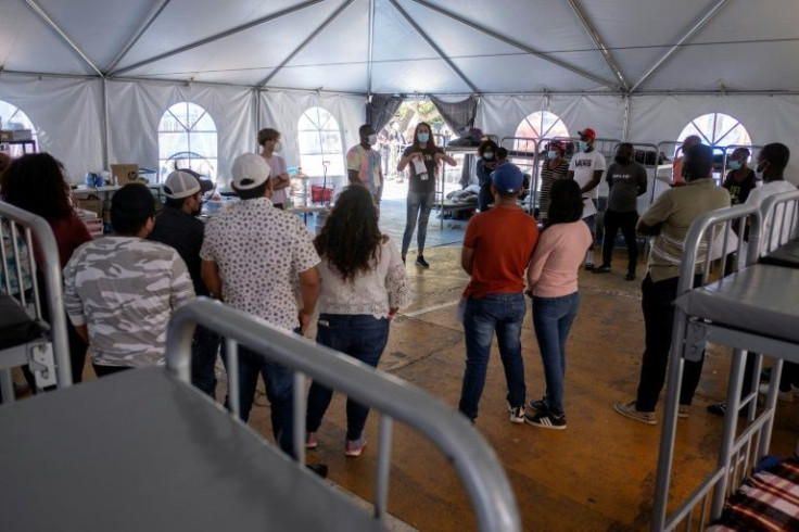 Brigitte Baltazar works in a camp with people who seek to enter the United States on "humanitarian parole," a status that covers emergency medical treatment or visiting a sick family member