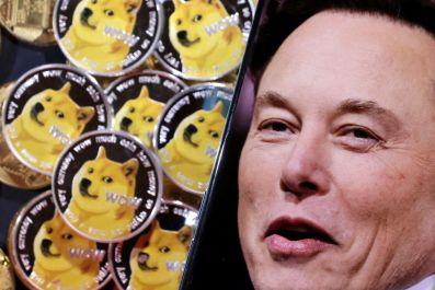 A photo of Elon Musk is displayed on a smartphone placed on representations of cryptocurrency Dogecoin in this illustration taken June 16, 2022. 
