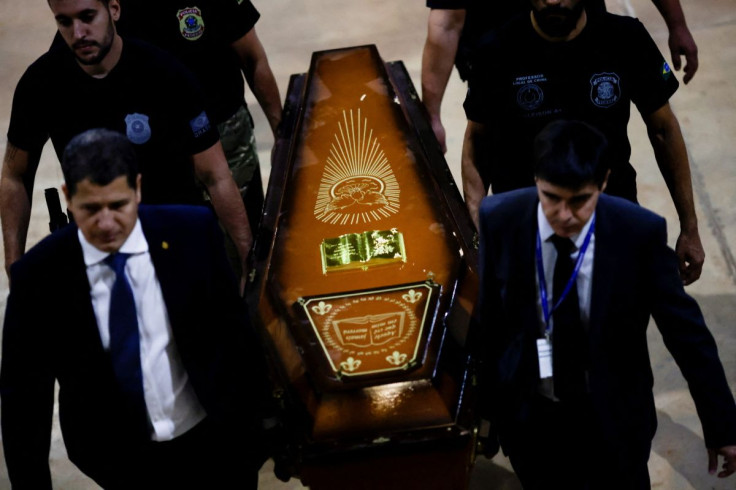 Federal Police officers carry a coffin containing human remains after a suspect confessed to killing British journalist Dom Phillips and Brazilian indigenous expert Bruno Pereira and led police to the location of remains, at the headquarters of the Federa