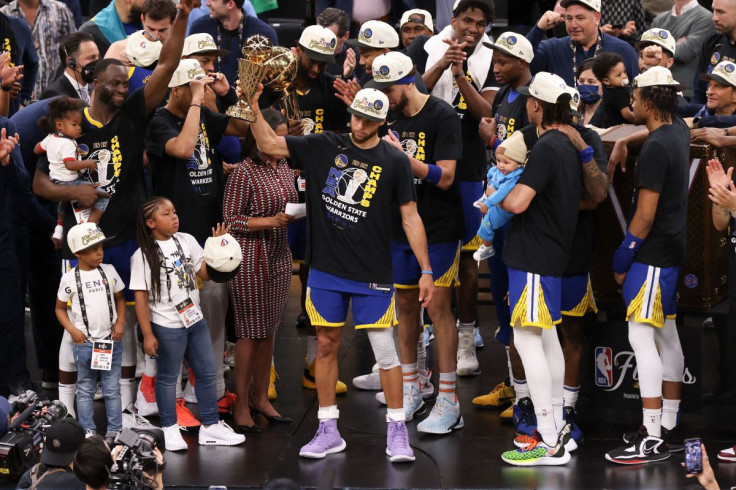 Jun 16, 2022; Boston, Massachusetts, USA; Golden State Warriors guard Stephen Curry (30) holds up the Most Valuable Player award after defeating the Boston Celtics in game six in the 2022 NBA Finals at the TD Garden. Mandatory Credit: Paul Rutherford-USA 