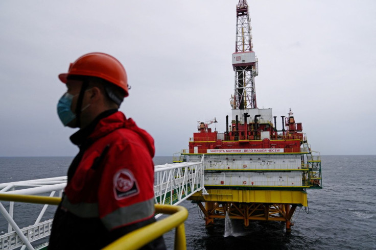 An employee is seen at an oil platform operated by Lukoil company at the Kravtsovskoye oilfield in the Baltic Sea, Russia September 16, 2021. 