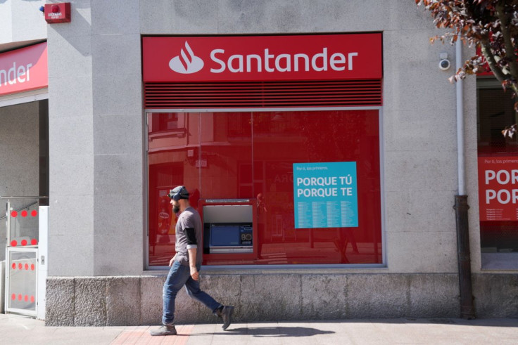 A man walks past a Santander bank branch in Guernica, Spain, April 26, 2022. 