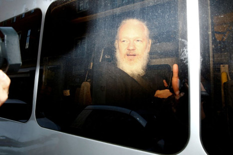 WikiLeaks founder Julian Assange is seen in a police van, after he was arrested by British police, in London, Britain April 11, 2019. 