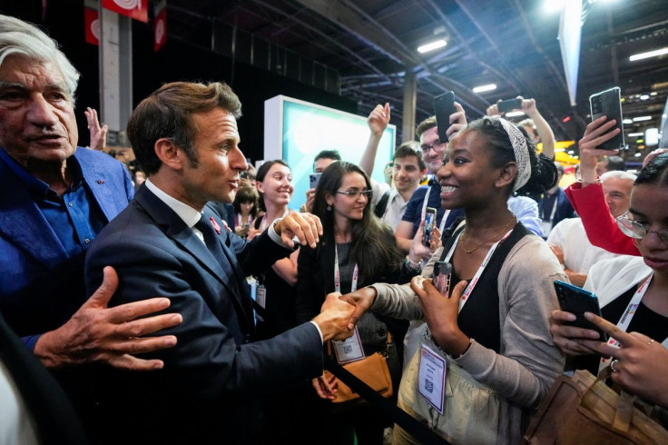 French President Emmanuel Macron meets people during a visit to the VivaTech start-up and technology conference in Paris, France, June 17, 2022. Michel Euler/Pool via REUTERS