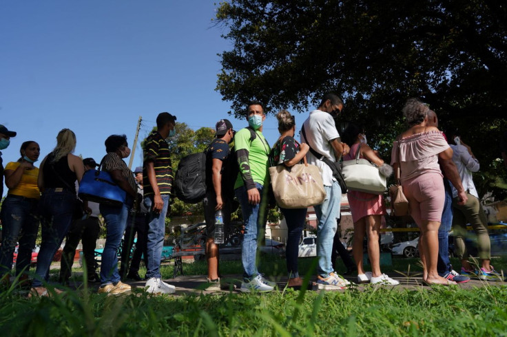 People wait their turn for visa procedures nearby the embassy of Panama in Havana, Cuba, June 13, 2022. Picture taken on June 13, 2022. 