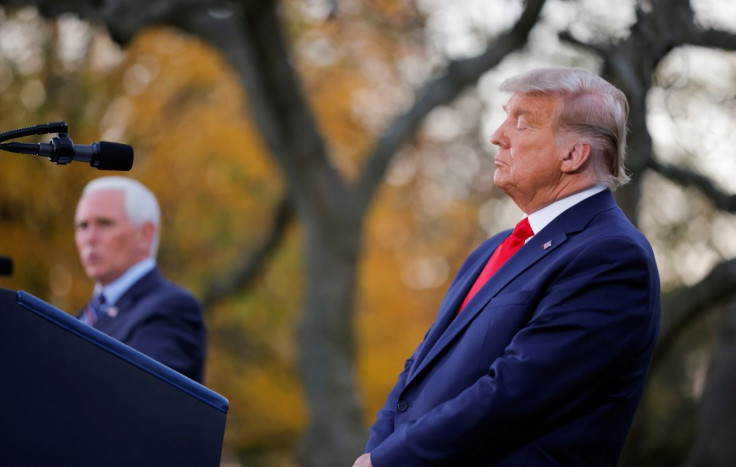 U.S. President Donald Trump listens to Vice President Mike Pence speak during an event about the "Operation Warp Speed" program, the joint Defense Department and HHS initiative that has struck deals with several drugmakers in an effort to help speed up th