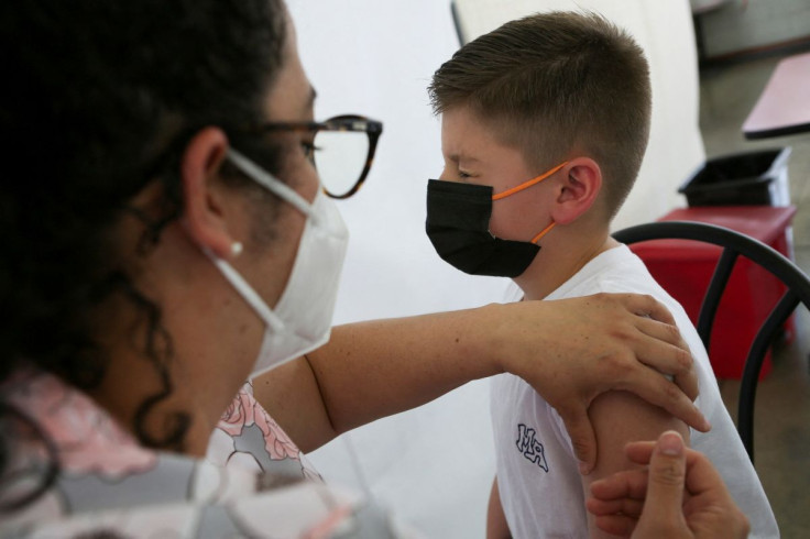 A child is administered a dose of the Pfizer-BioNTech coronavirus disease (COVID-19) pediatric vaccine, in San Jose, Costa Rica February 23, 2022. 