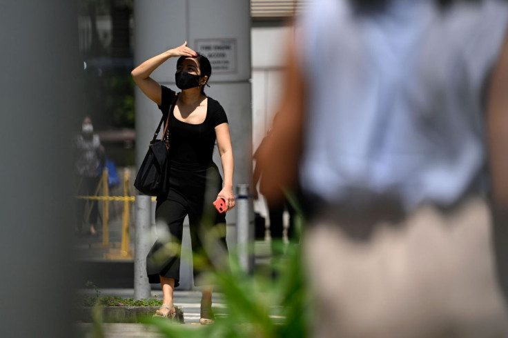 A lady strolls along the street amid the coronavirus disease (COVID-19) Omicron wave in Singapore, February 17, 2022. 