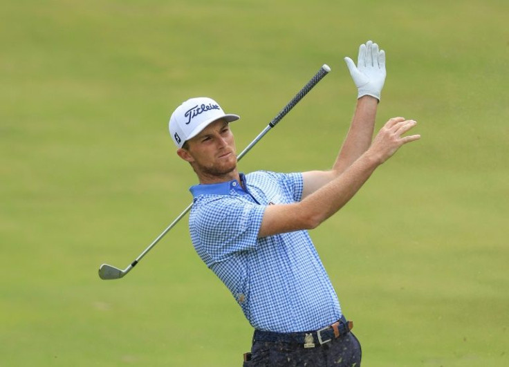 American Will Zalatoris lets go of his club as he plays his second shot on the eighth hole on the way to a share of the third-round lead of the US Open