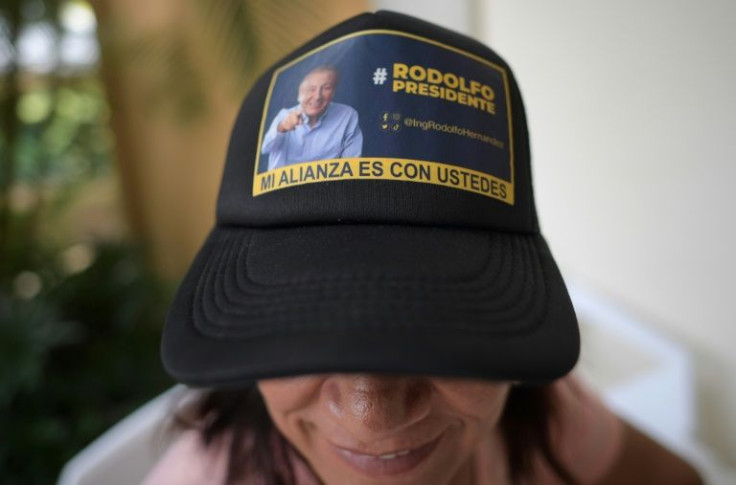 A woman wears a cap with the image of Colombian presidential candidate Rodolfo Hernandez, in Bucaramanga, Colombia on June 18, 2022