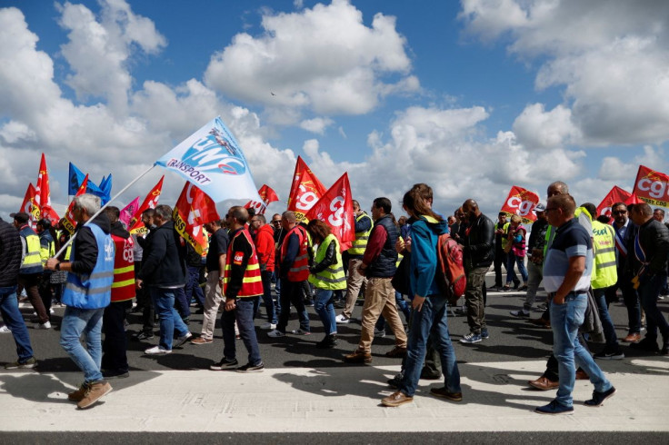Paris-Charles de Gaulle airport employees gather outside terminal 2E as they take part in a protest against low wages at the Paris-Charles de Gaulle airport in Roissy, near Paris, France, June 9, 2022. 