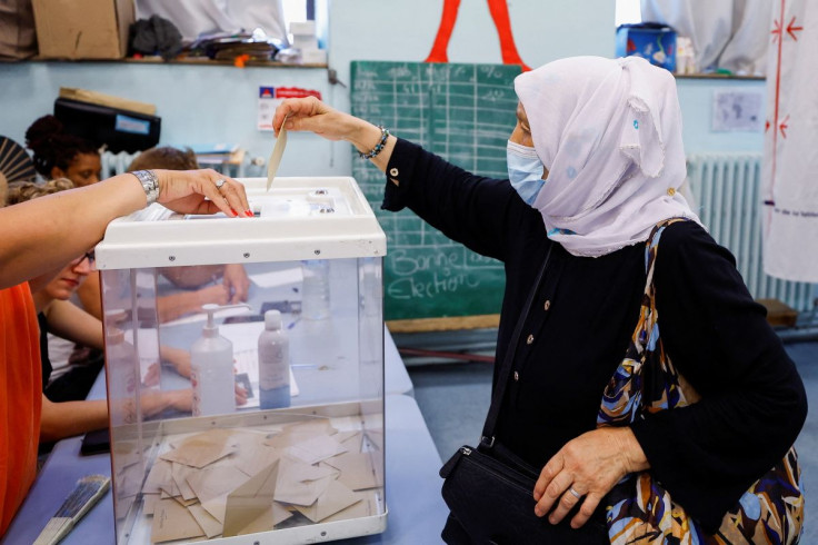 A voter casts ballot in the second round of the French parliamentary elections at a polling station in Marseille, France, June 19, 2022.