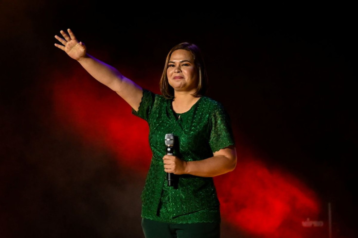 Vice-presidential candidate Sara Duterte-Carpio, daughter of Philippine President Rodrigo Duterte, waves to her supporters during the first day of campaign period for the 2022 presidential election, at the Philippine Arena, in Bocaue, Bulacan province, Ph