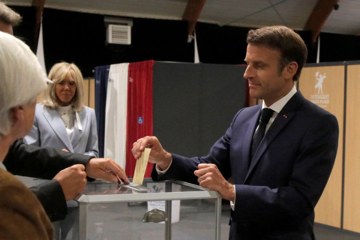 French President Emmanuel Macron casts his ballot during the final round of the country's parliamentary elections, in Le Touquet, France June 19, 2022 Michel Spingler/Pool via REUTERS