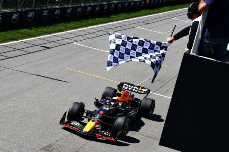 Victory: Max Verstappen takes the chequered flag