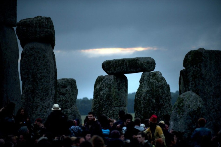Revellers surround the ancient Stonehenge monument