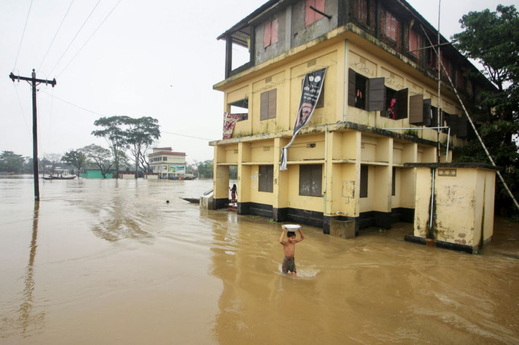 A boy wades through a flooded area during a widespread flood in the northeastern part of the country, in Sylhet, Bangladesh, June 19, 2022. 