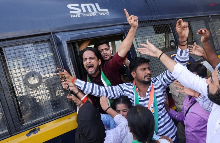 Indian Youth Congress supporters, are detained by the police during a protest against the Agneepath recruitment scheme on a street in Mumbai, India, June 18, 2022.
