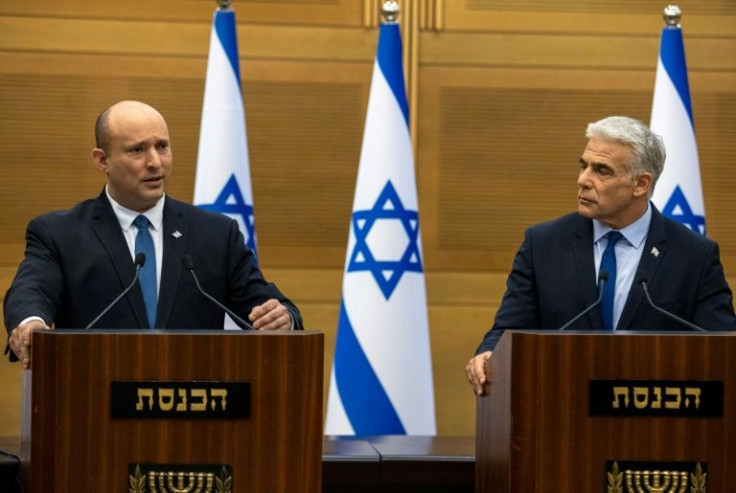 Israeli Prime Minister Naftali Bennett (L) has said Foreign Minister Yair Lapid (R) will take over as premier within days