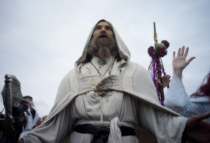 A druid prays for peace during incantations at the summer solstice ceremony at Stonehenge on Salisbury plain in southern England June 21