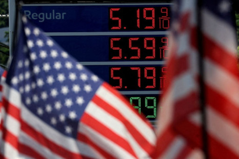 Gasoline prices are displayed at an Exxon gas station behind American flag in Edgewater, New Jersey, U.S., June 14, 2022. 