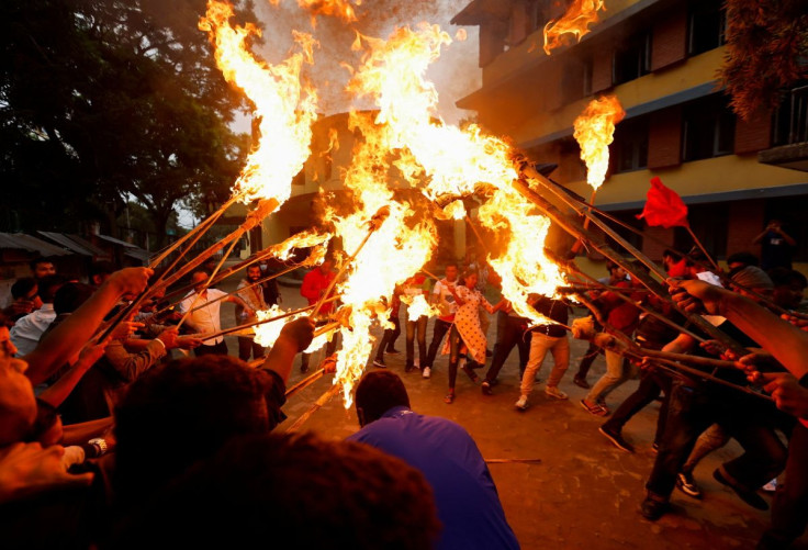 Students affiliated with the main opposition party hold a torch rally during the protest against the rise in fuel prices in Kathmandu, Nepal June 20, 2022.