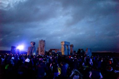 Revellers surround the ancient Stonehenge