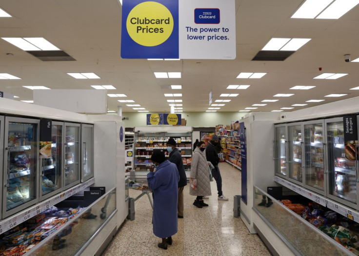 Shoppers walk in a branch of a Tesco supermarket in London, Britain, February 10, 2022. Picture taken February 10, 2022. 