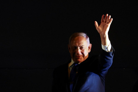 Former Prime Minister Benjamin Netanyahu waves to a rally held by right-wing Israelis in Jerusalem, April 6, 2022. 