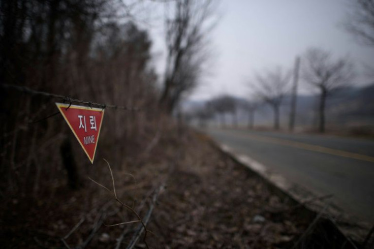A sign warns of landmines in woodland near the Demilitarized Zone in Yeoncheon, north of Seoul, in 2015