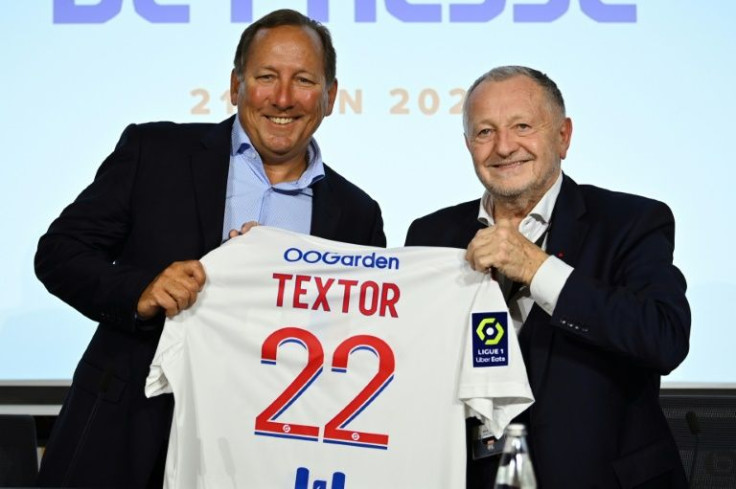 Lyon president Jean-Michel Aulas (R) and US businessman John Textor (L)