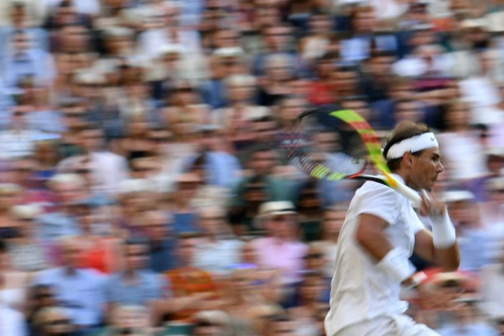 Action man: Rafael Nadal returns the ball to Roger Federer during their 2019 semi-final