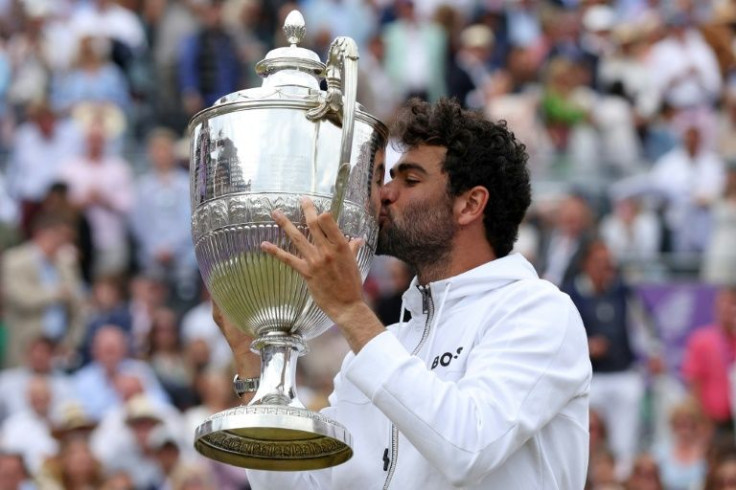 Outsider?: Italy's Matteo Berrettini kisses the trophy as he celebrates winning Queen's