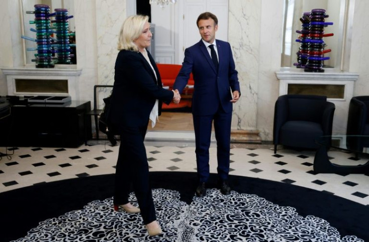 French President Emmanuel Macron is hosting rare talks at the Elysee with opposition leaders, including far-right leader Marine Le Pen