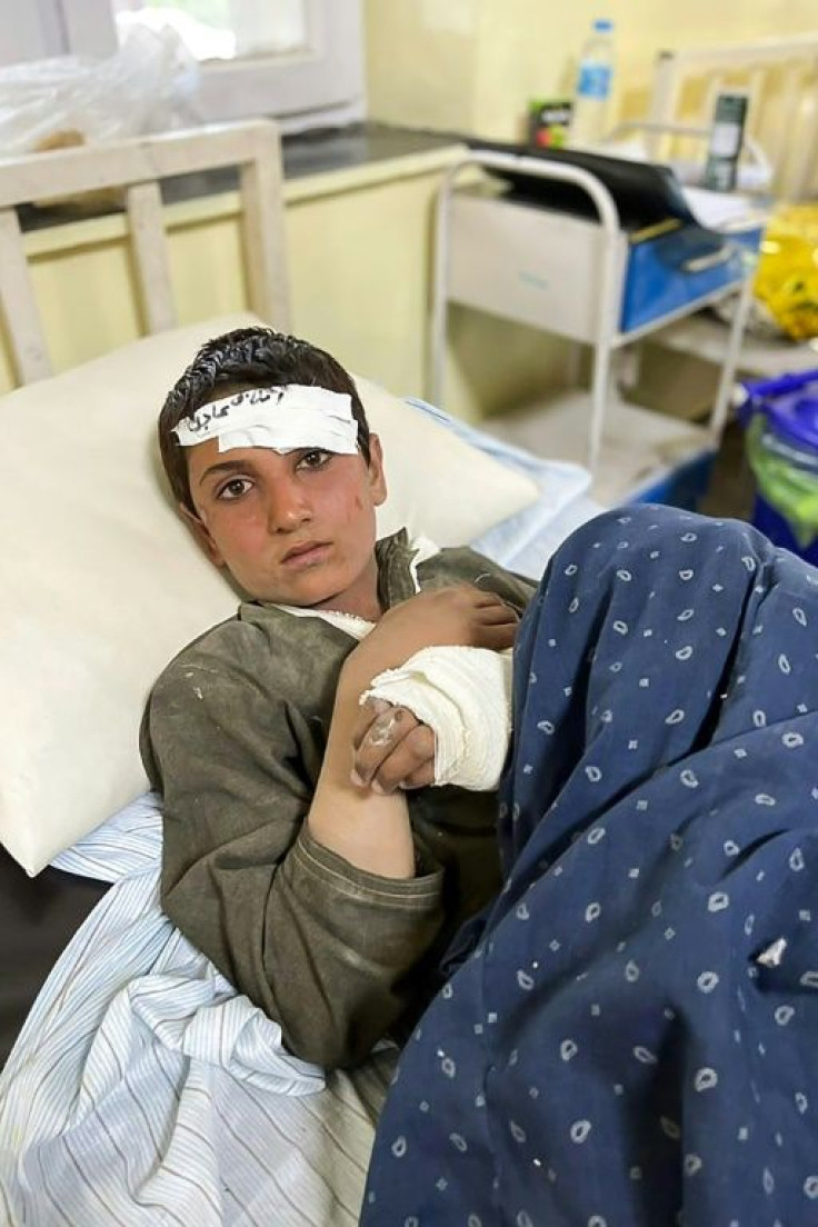An Afghan youth is treated inside a hospital in the city of Sharan after he was injured in Wednesday's earthquake