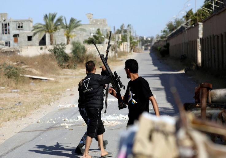 Members of the Libyan internationally recognised government forces are seen during a fight with Eastern forces in al-Yarmouk south of Tripoli, Libya May 7, 2019. 