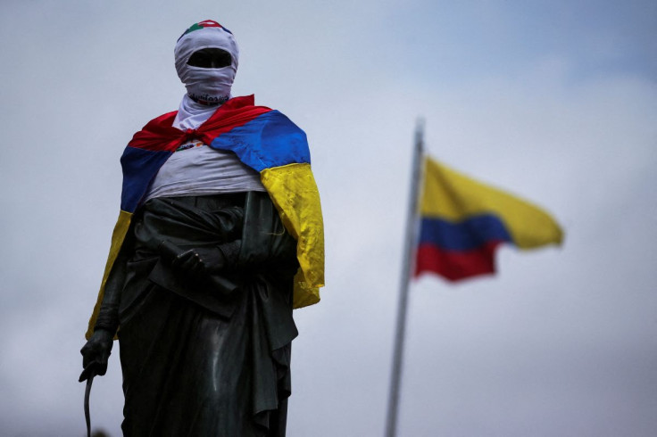 The statue of Simon Bolivar, located in Plaza Bolivar, is seen covered by the Colombian flag the morning after the second round of the presidential election, in Bogota, Colombia June 20, 2022. 