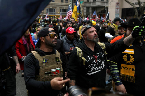 Proud Boys members Enrique Tarrio, left, and Joe Biggs march during a December 12, 2020 protest in Washington, D.C. 