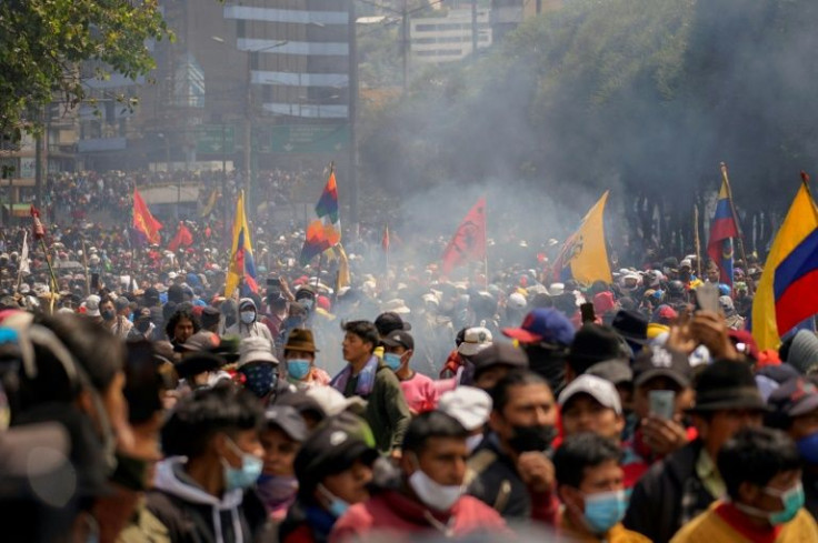 Demonstrators march from the Central University to the House of Ecuadorian Culture in Quito