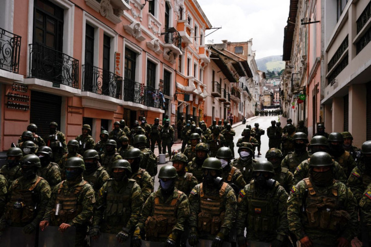 Security forces stand guard as protesters march to demand President Guillermo Lasso address price increases for fuel, food and other basics which have ignited 10 days of demonstrations across the country, in Quito, Ecuador June 22, 2022. 