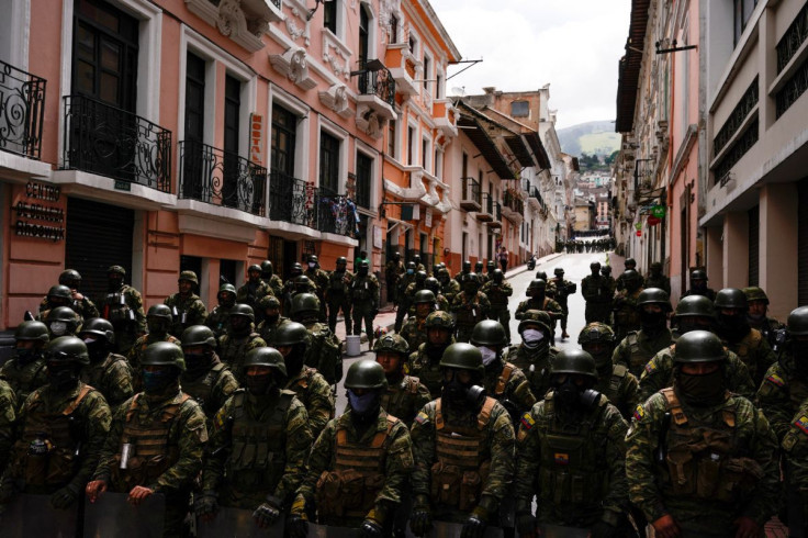 Security forces stand guard as protesters march to demand President Guillermo Lasso address price increases for fuel, food and other basics which have ignited 10 days of demonstrations across the country, in Quito, Ecuador June 22, 2022.