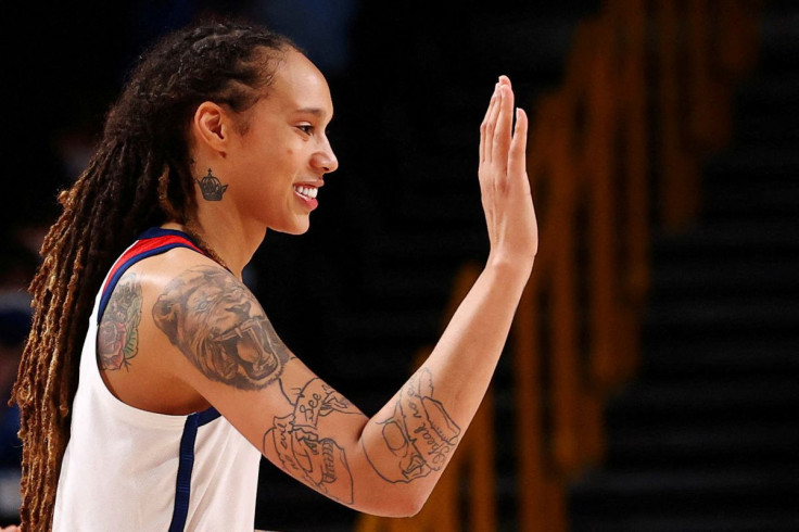 Brittney Griner of the United States congratulates a team mate during their Women's Basketball Gold Medal game against Japan at the Tokyo 2020 Summer Olympics at the Saitama Super Arena in Saitama, Japan, August 8, 2021.  Picture taken August 8, 2021.   
